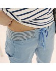 Długie damskie spodnie jegginsy luźne komfortowe wygodne niebieskie beżowe białe zawiązywane z gumką
